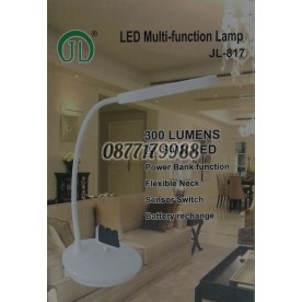 Настолна лампа с поставка за телефон.